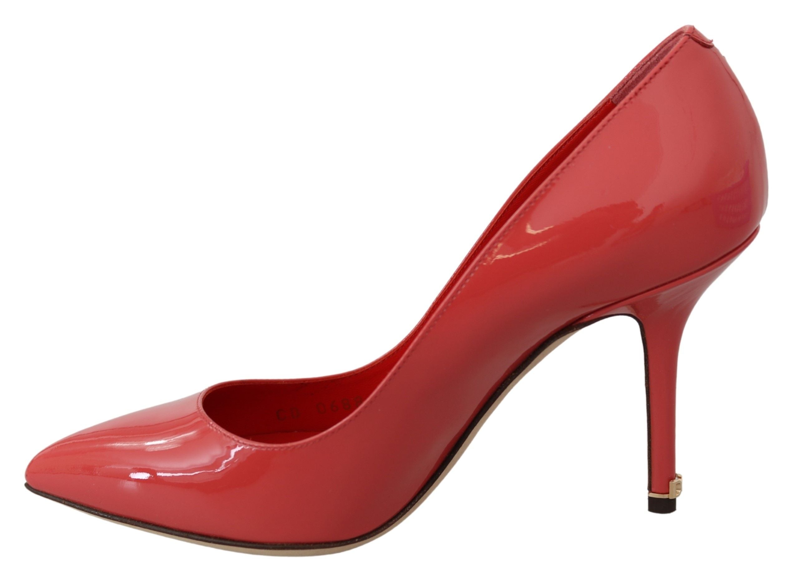 Dark pink patent leather heels pumps by Dolce & Gabbana, featuring a sleek design and pointed toe.
