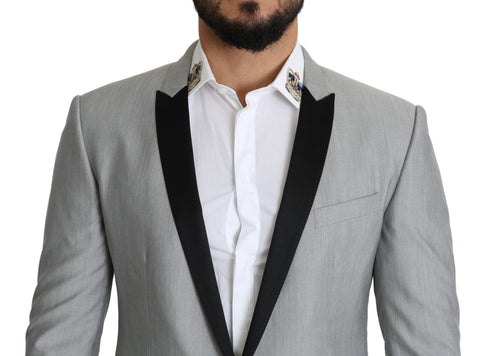 Light gray Dolce & Gabbana Sartoria single-breasted blazer displayed on a hanger, showcasing tailored design and classic fit.