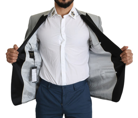 Light gray Dolce & Gabbana Sartoria single-breasted blazer with tailored fit and classic lapels, shown on a hanger.