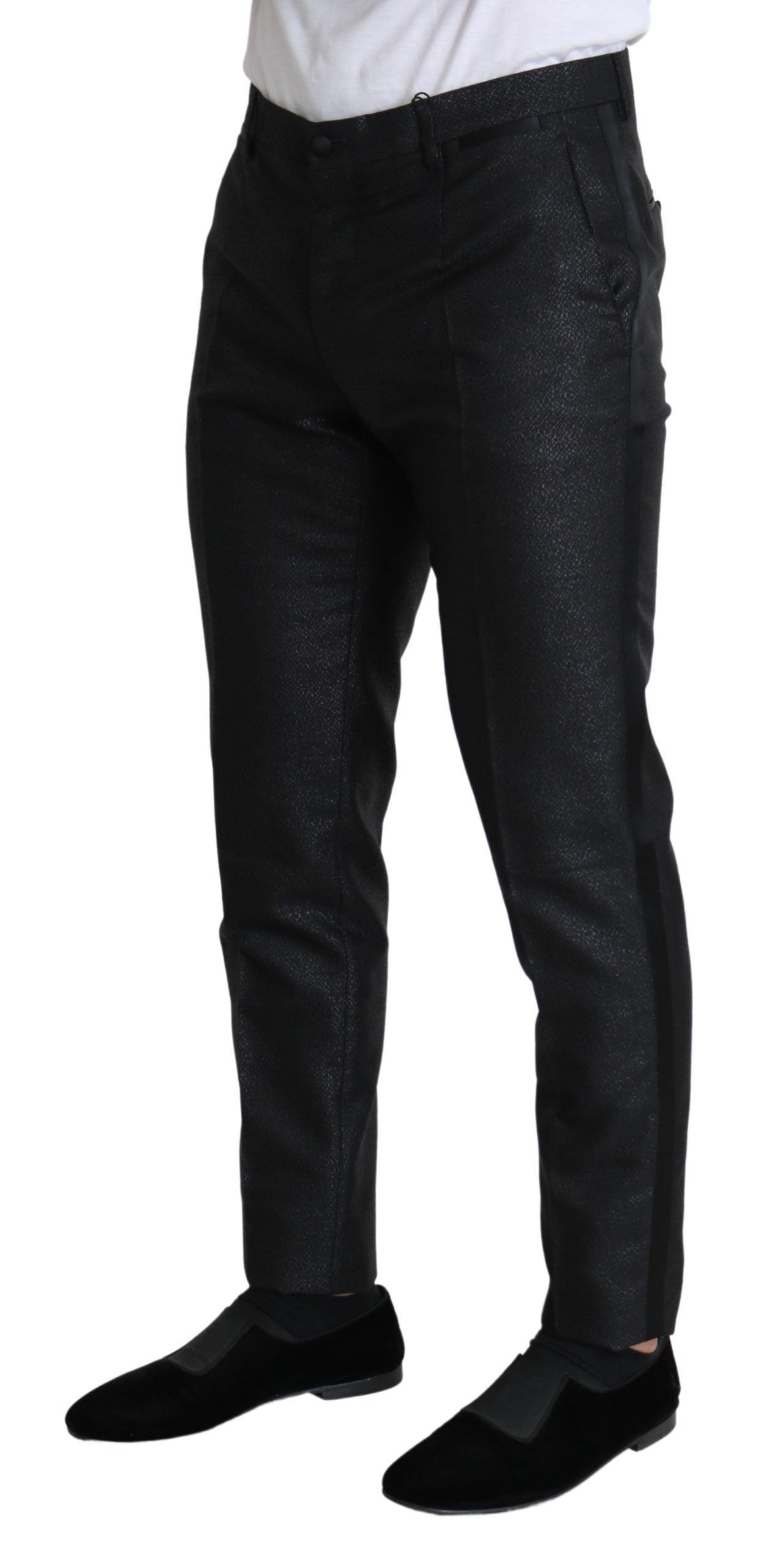 Black metallic skinny trouser dress by Dolce & Gabbana, close-up of fitted fabric and sleek metallic finish.