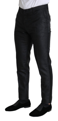 Black metallic skinny trouser dress by Dolce & Gabbana, close-up of fitted fabric and sleek metallic finish.