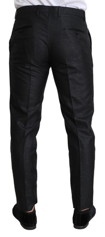 Black metallic skinny trouser dress by Dolce & Gabbana, featuring a sleek fitted silhouette and shiny metallic fabric.