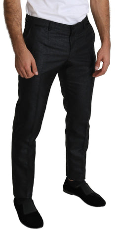 Black metallic skinny trouser dress by Dolce & Gabbana, close-up of sleek, fitted fabric with metallic sheen and stylish design.