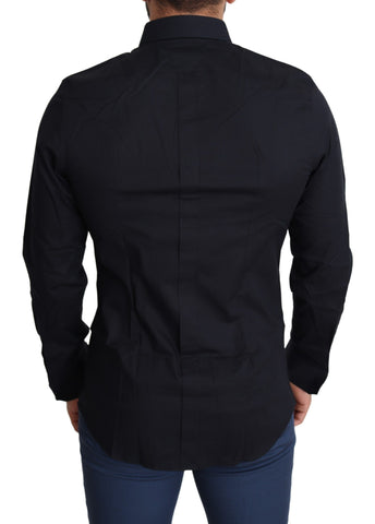 Blue cotton formal dress shirt by Dolce & Gabbana, featuring a classic gold accent, displayed on a mannequin.