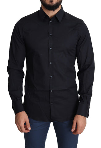 Blue cotton formal dress shirt by Dolce & Gabbana with gold accents, neatly folded with collar and buttons visible.