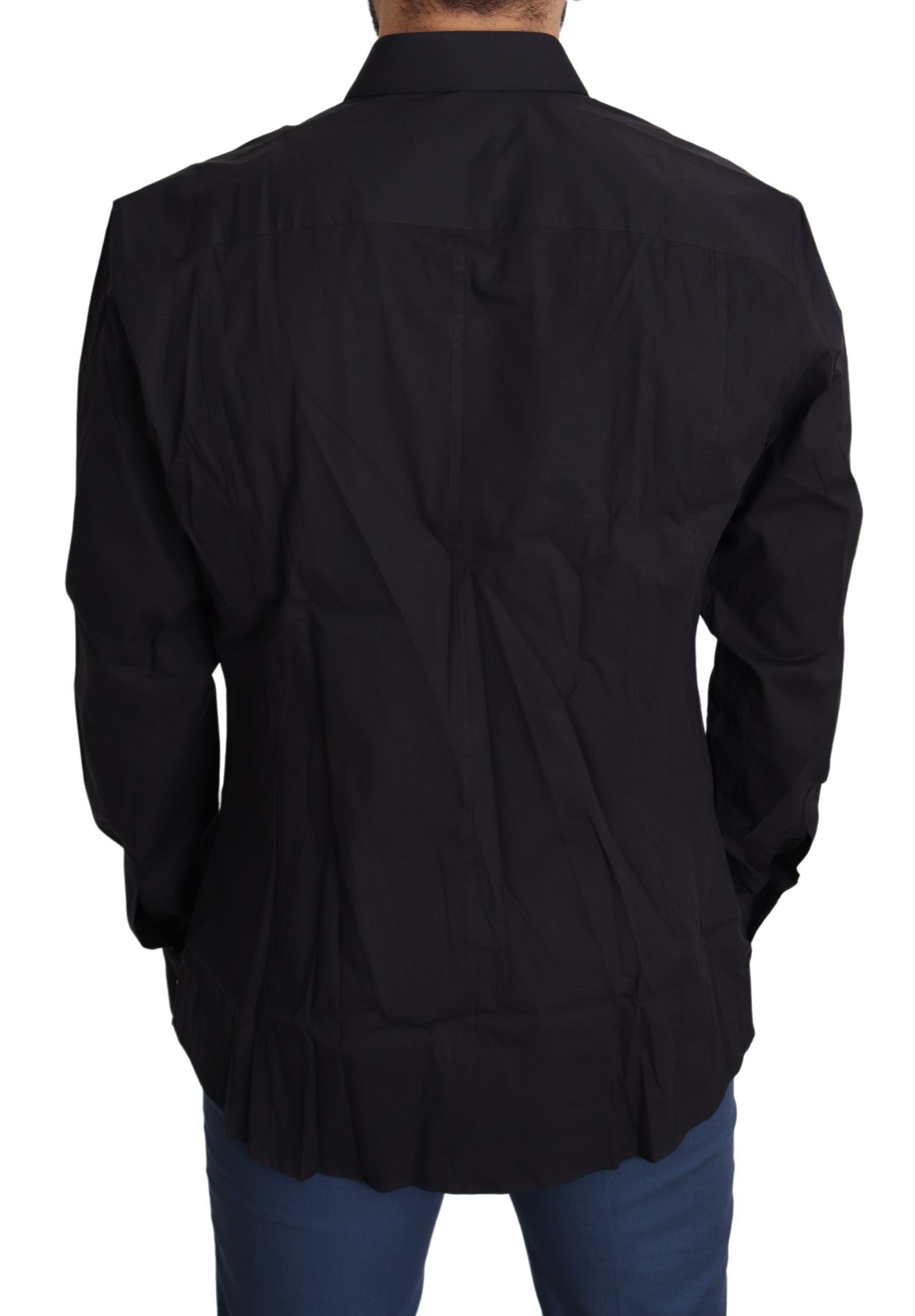 Black cotton stretch dress by Dolce & Gabbana, Sicilia shirt style, fitted silhouette, with long sleeves and classic neckline.