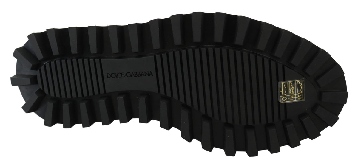 Black rubberized calfskin chunky derby shoes by Dolce & Gabbana with a bold, textured design and sturdy sole.