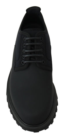 Black rubberized calfskin chunky Derby shoes by Dolce & Gabbana, featuring a rugged vulcano sole and sleek design.