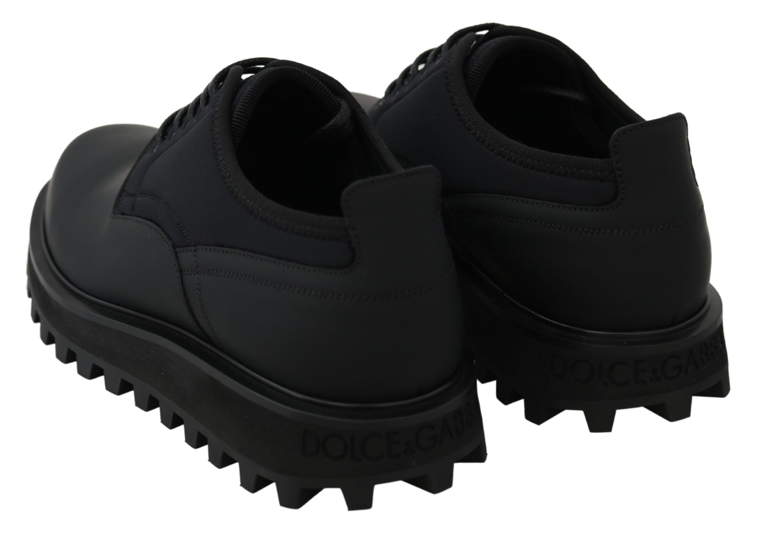 Black rubberized calfskin chunky derby shoes by Dolce & Gabbana, showcasing a sleek, stylish design with a sturdy sole.