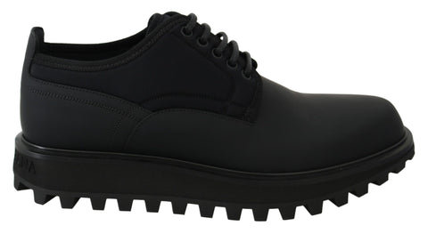 Black rubberized calfskin chunky derby shoes by Dolce & Gabbana, featuring a sleek design and sturdy sole.