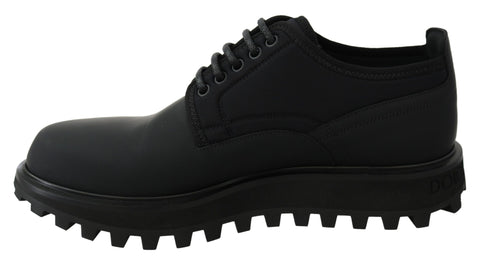 Black rubberized calfskin chunky derby shoes by Dolce & Gabbana, featuring a rugged vulcano sole and stylish design.