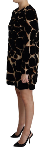Black giraffe print shift mini dress by Dolce & Gabbana featuring a stylish silhouette and bold animal pattern.