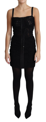 Black lace-up floral corset bustier mini dress by Dolce & Gabbana, featuring intricate lace details and a fitted silhouette.