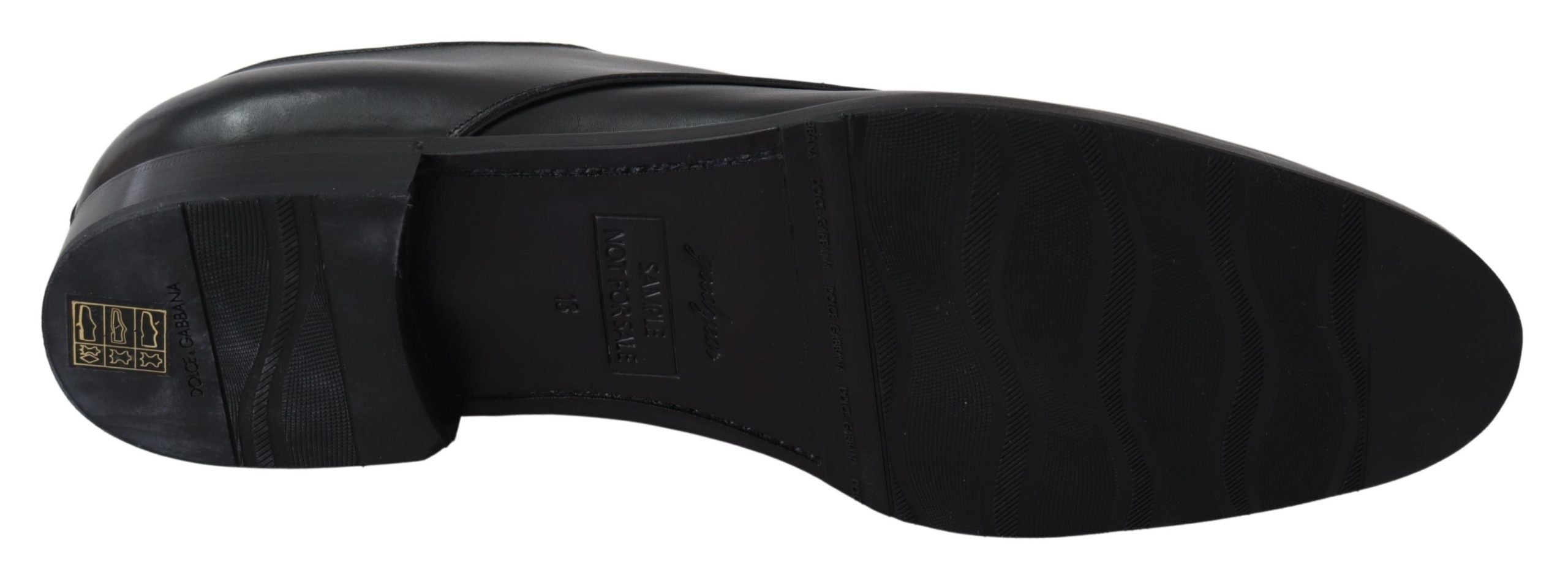 Black leather SARTORIA handmade shoes by Dolce & Gabbana with detailed stitching and sleek design.