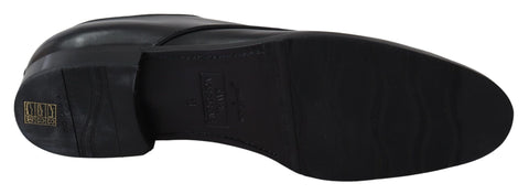 Black leather SARTORIA handmade shoes by Dolce & Gabbana with detailed stitching and sleek design.