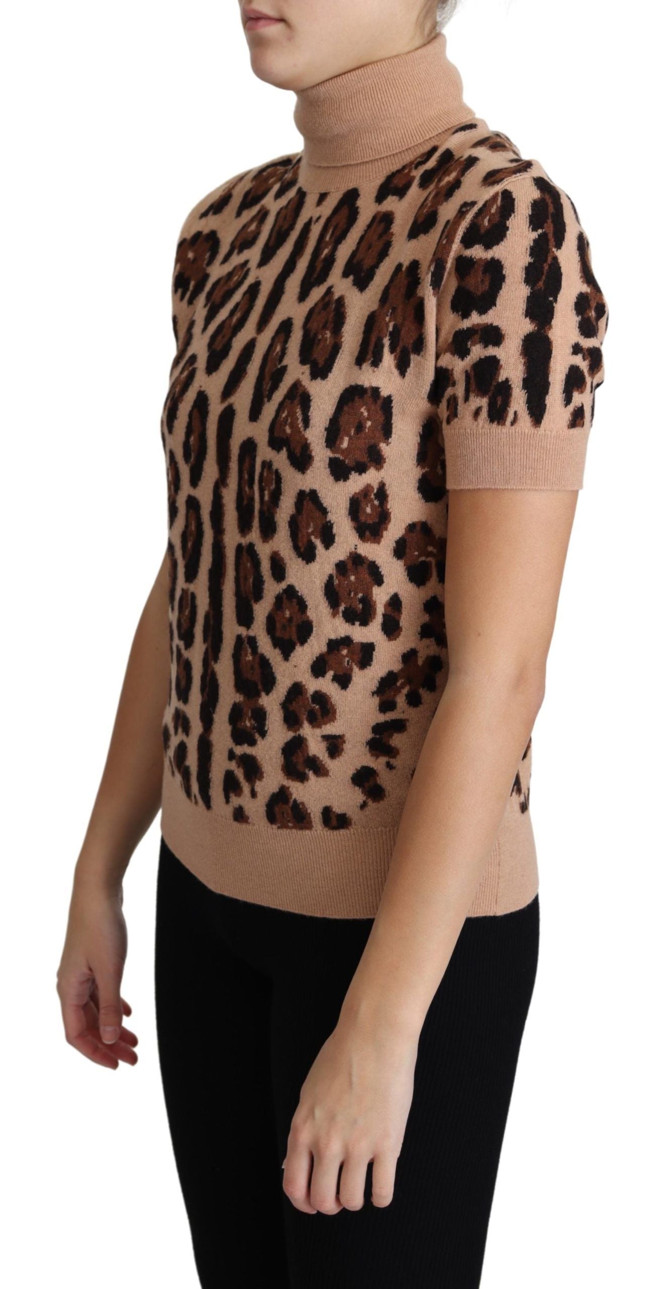 Beige leopard print virgin wool turtleneck top by Dolce & Gabbana, close-up view of the stylish, fitted sweater with high neckline.
