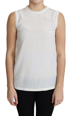 White silk sleeveless blouse with lace trim by Dolce & Gabbana, shown with elegant neckline and delicate fabric details.