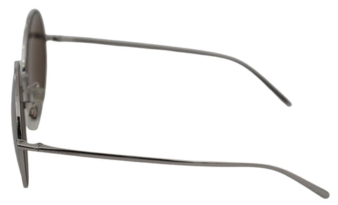 Silver plated round gray lenses women's sunglasses by Dolce & Gabbana with sleek metal frames and tinted lenses.