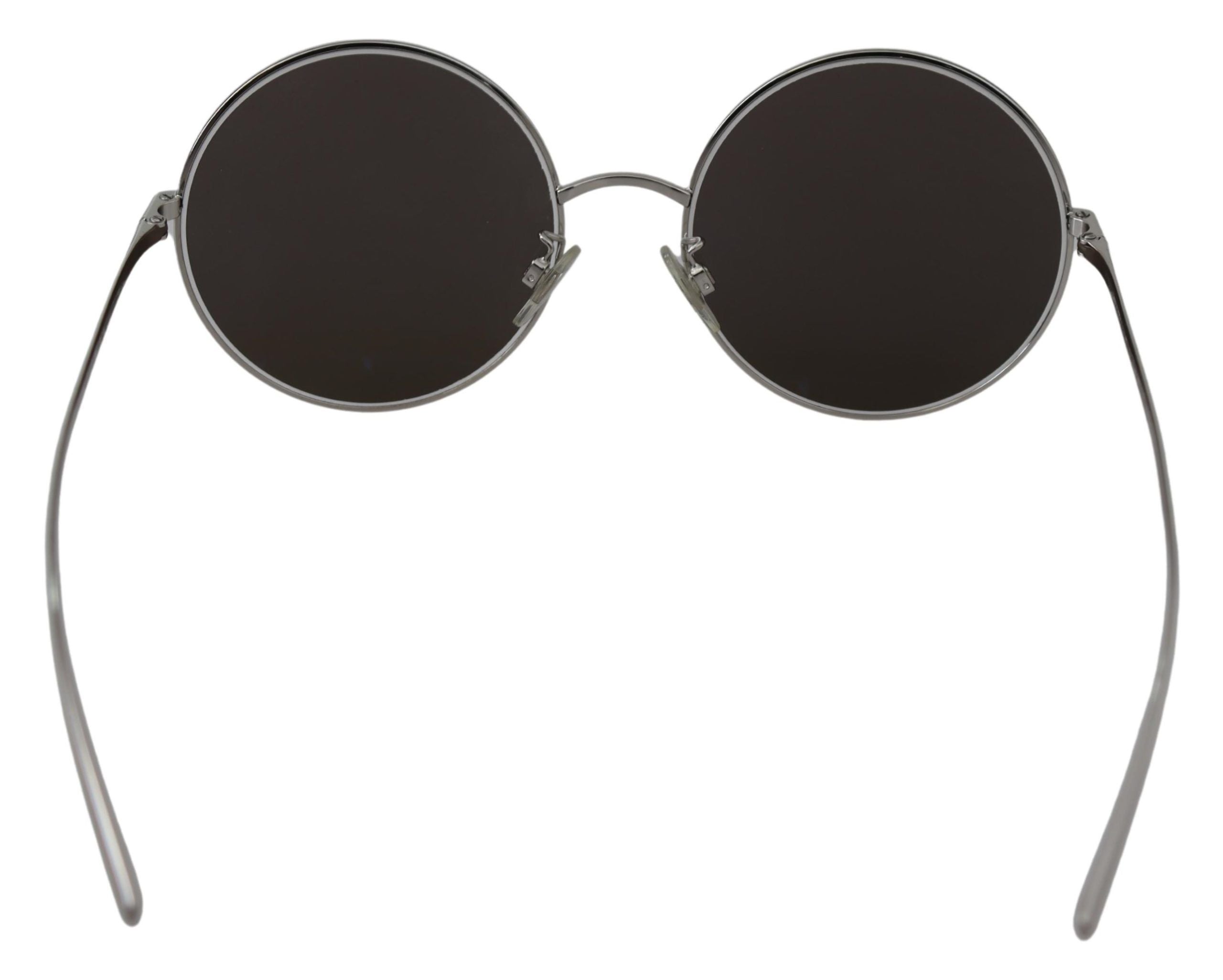 Silver plated round gray lenses women’s sunglasses by Dolce & Gabbana with metal frames and stylish design.