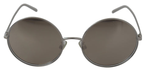 Silver plated round gray lenses women's sunglasses by Dolce & Gabbana with sleek frame and stylish design.