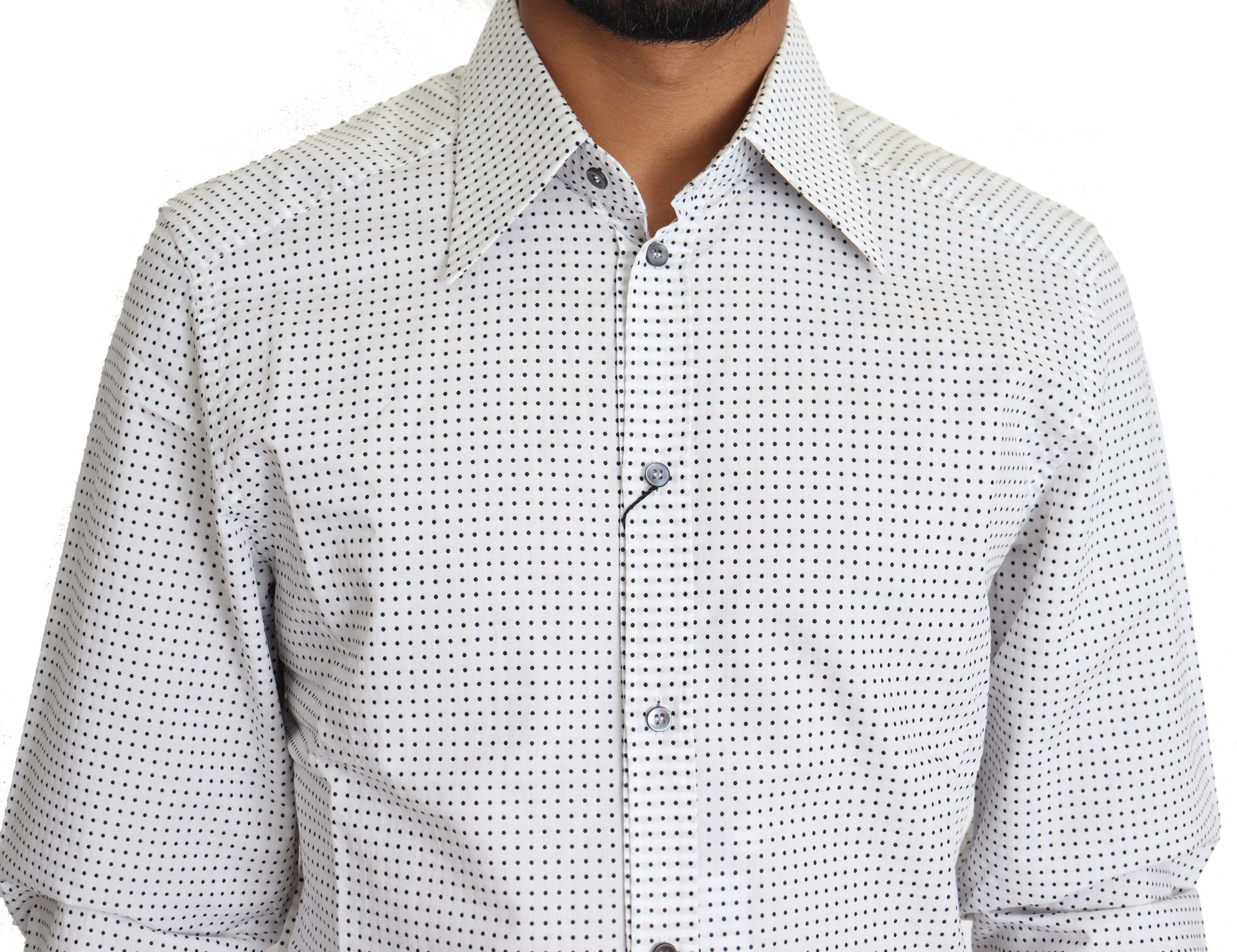 Black and white polka dot dress shirt by Dolce & Gabbana, featuring long sleeves and classic collar, laid flat.