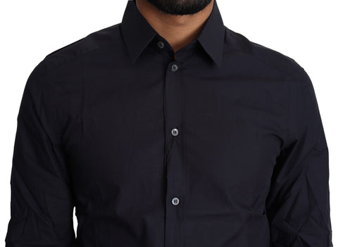 Navy blue cotton formal dress shirt by Dolce & Gabbana, shown on a hanger with a button-down front and classic collar.