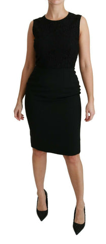 Black floral lace sheath gown dress by Dolce & Gabbana with intricate lace details and a fitted silhouette.