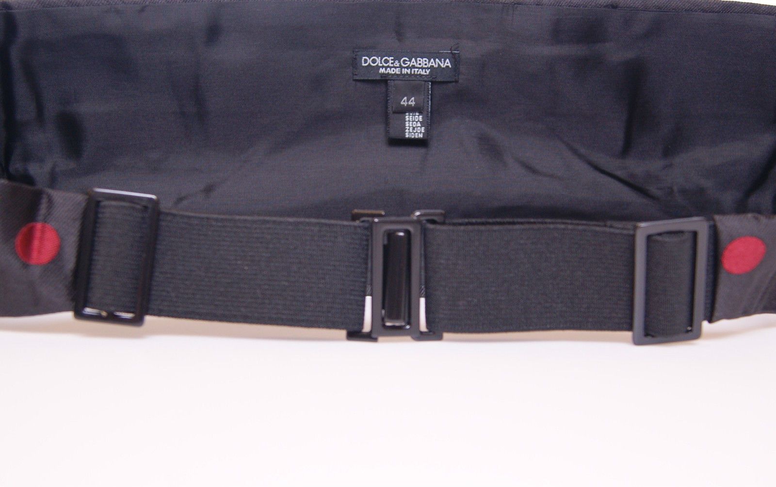 Black waist smoking tuxedo cummerbund belt by Dolce & Gabbana, with smooth fabric and elegant design for formal wear.