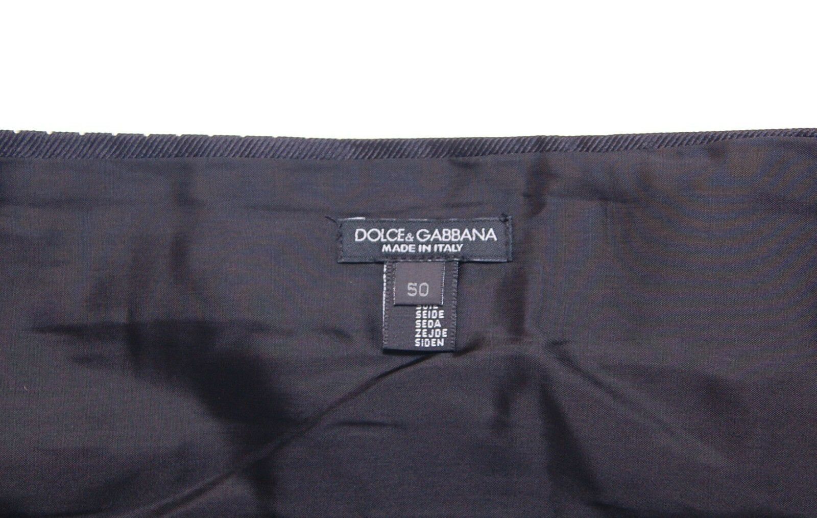 Black waist smoking tuxedo cummerbund belt by Dolce & Gabbana, with sleek fabric and elegant design for formal occasions.