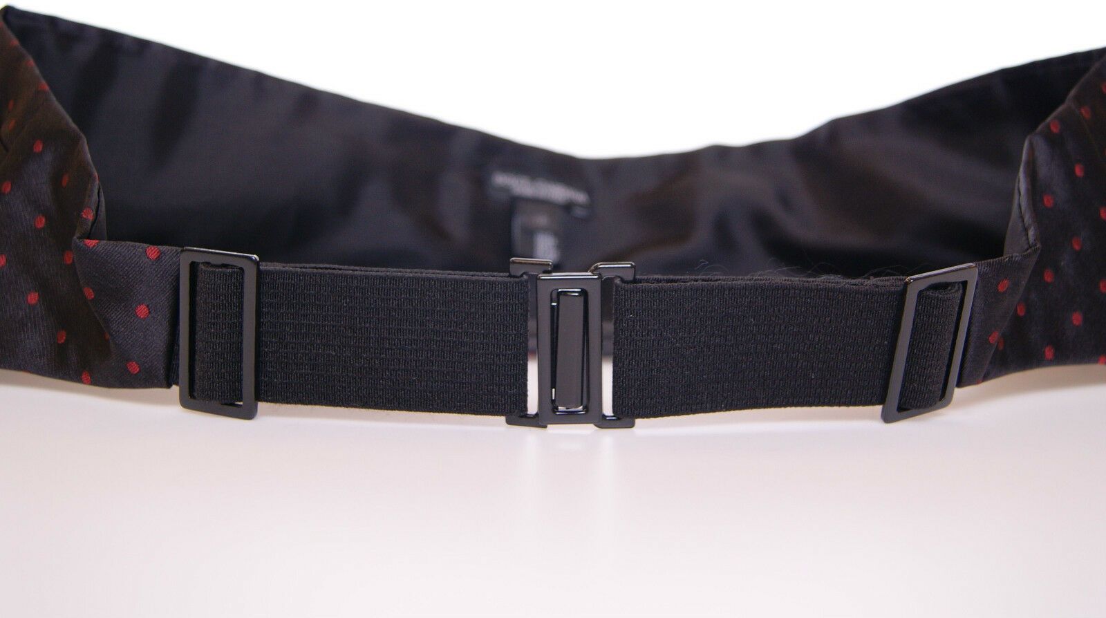 Black waist tuxedo cummerbund by Dolce & Gabbana, featuring a sleek, satin finish and elegant design for formal evening wear.