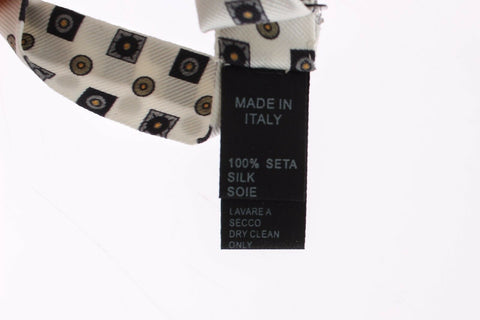 White silk bowtie, leather men's belt from Dolce & Gabbana in a gift box, featuring elegant design and refined craftsmanship.