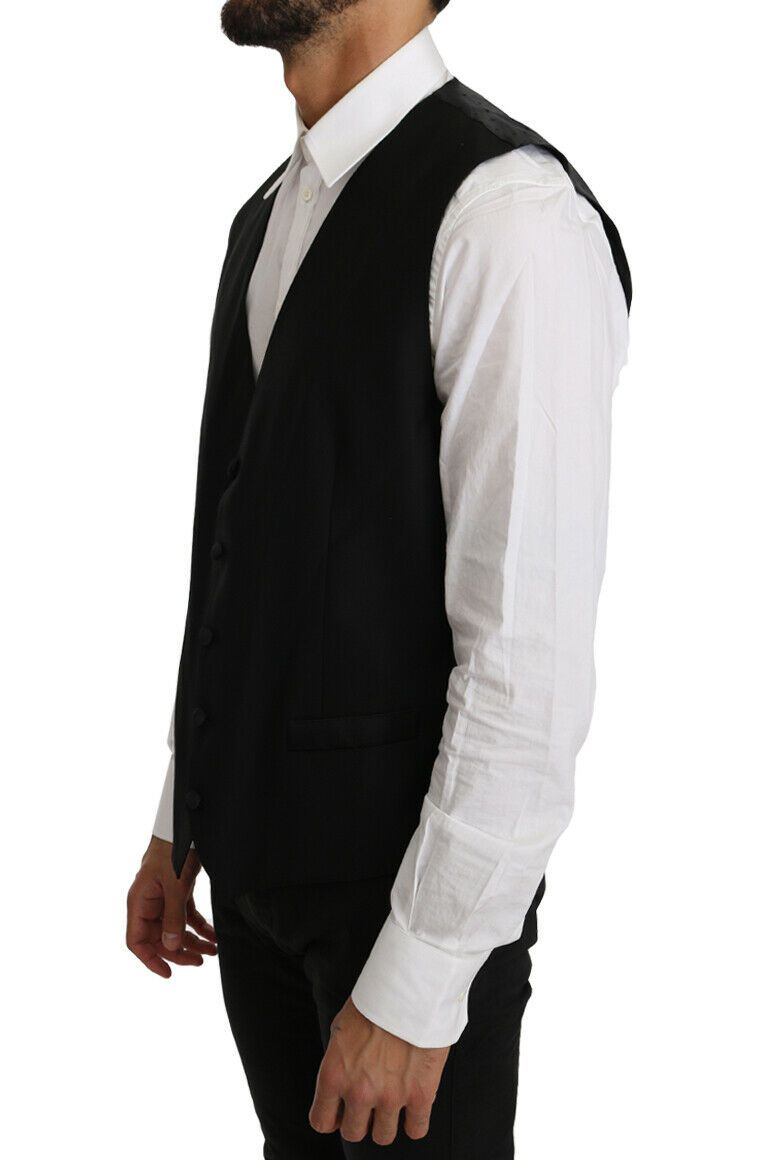 Black solid wool silk vest by Dolce & Gabbana, close-up showing smooth fabric and tailored fit.