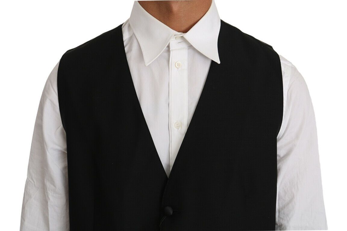 Black solid wool silk vest by Dolce & Gabbana, front view showing tailored fit and smooth fabric texture.