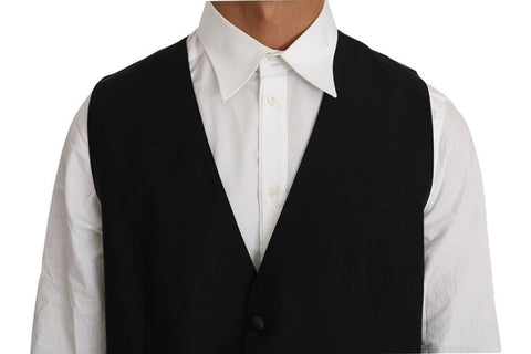 Black solid wool silk vest by Dolce & Gabbana, front view showing tailored fit and smooth fabric texture.