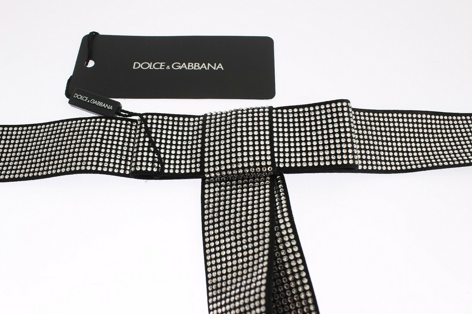 Black silk waist belt with clear crystal bow detail by Dolce & Gabbana, featuring a sleek, elegant design.