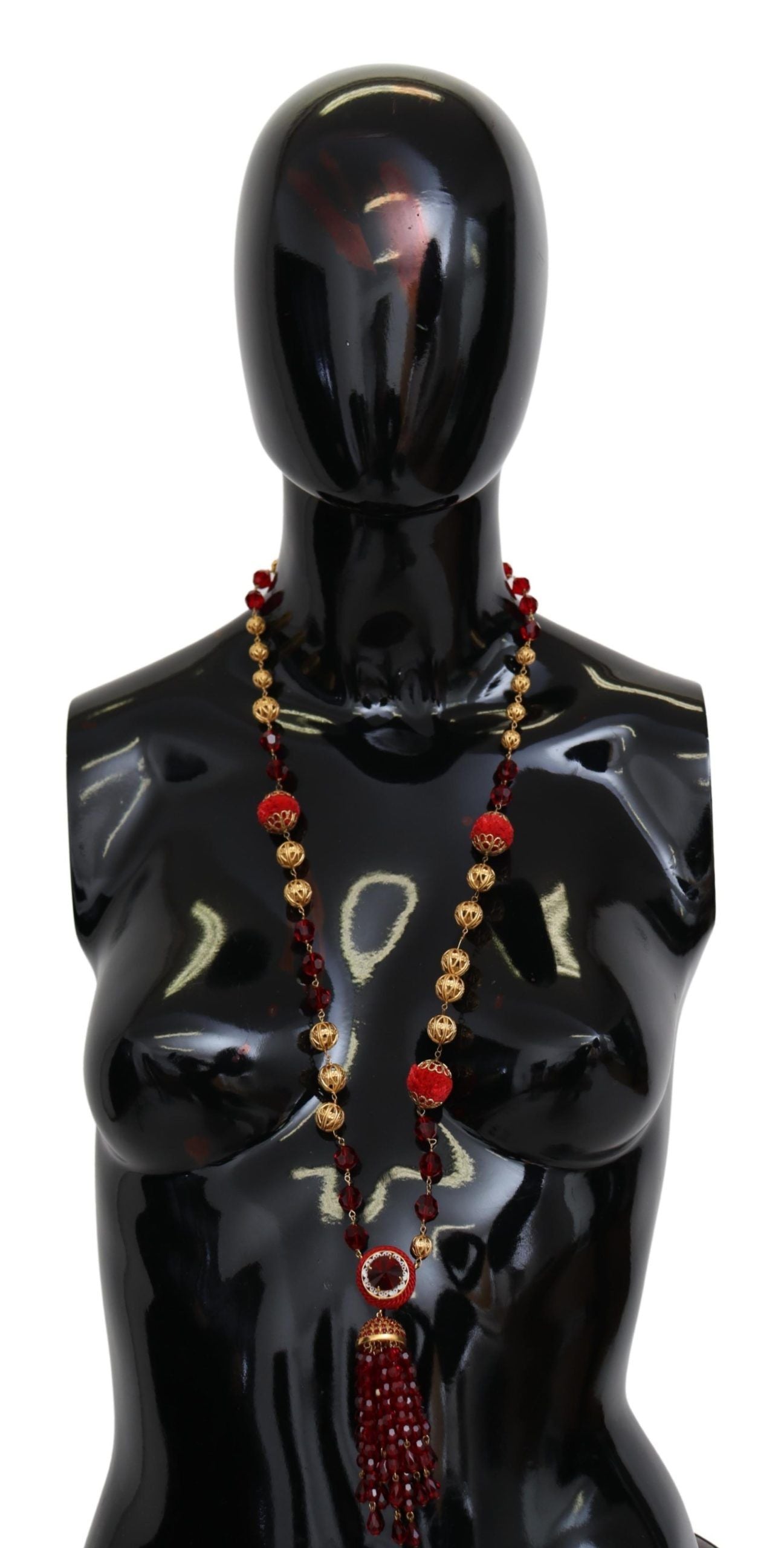 Gold tone brass necklace with red crystal pendant and opera chain from Dolce & Gabbana, featuring a luxurious, elegant design.