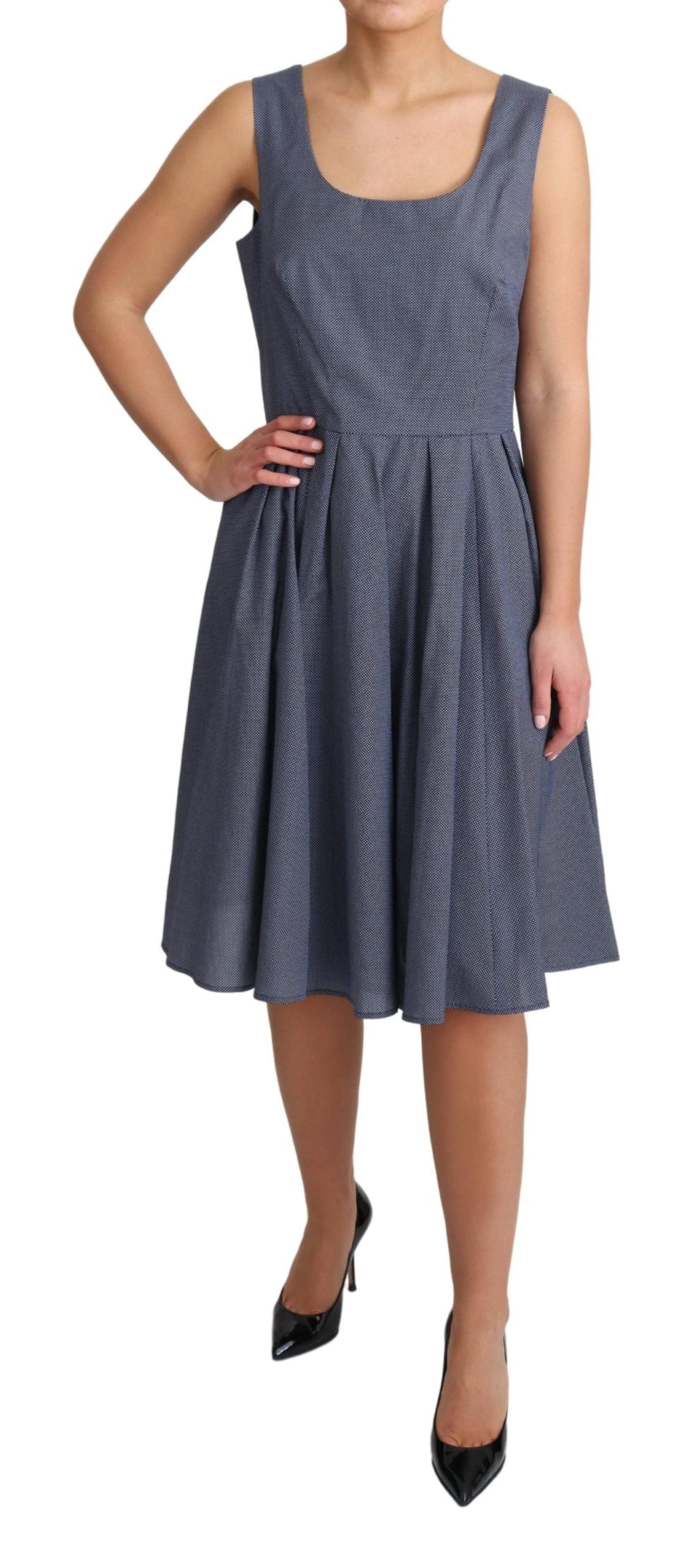 Blue polka dot cotton A-line stretch dress by Dolce & Gabbana, shown on a model with a fitted waist and flared skirt.