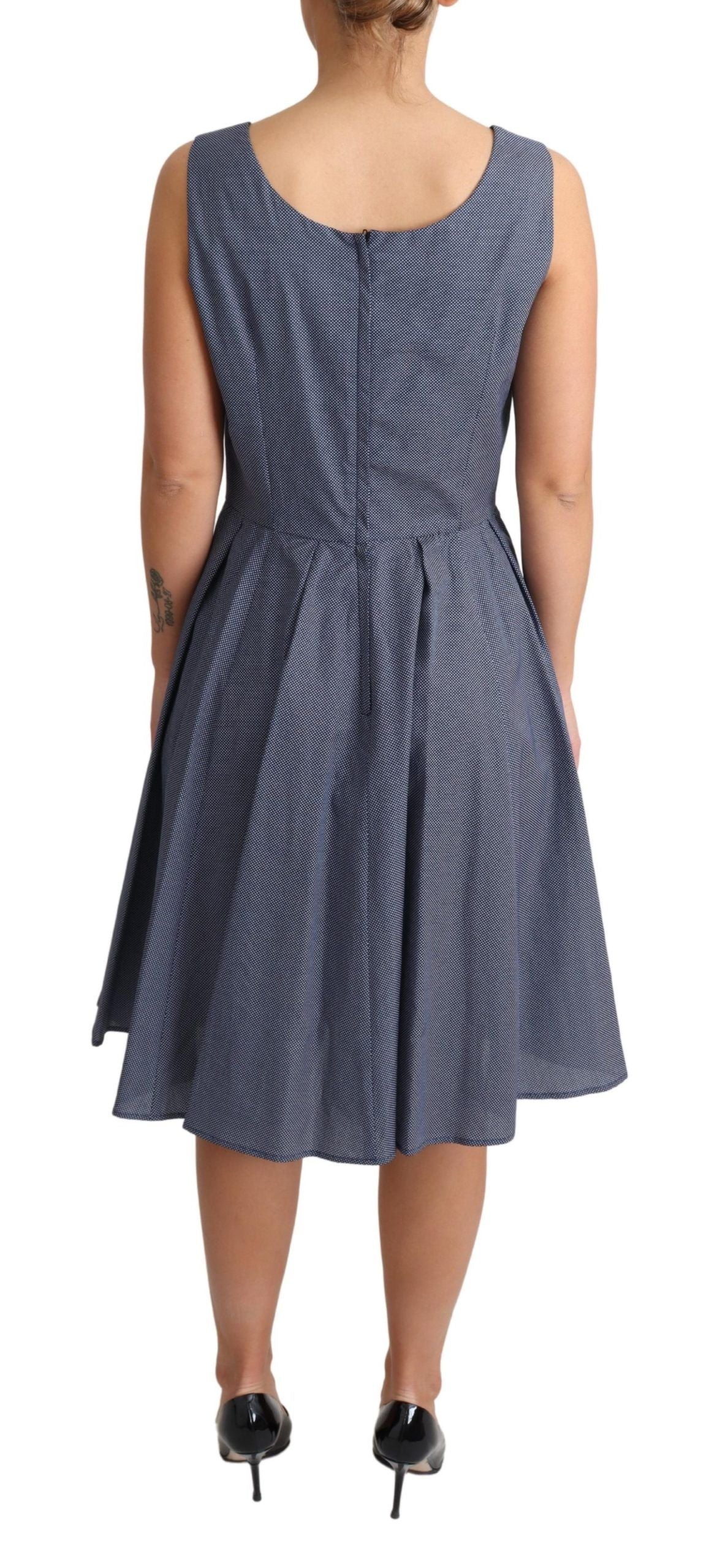 Blue polka dot cotton A-line stretch dress by Dolce & Gabbana, shown on a hanger with a fitted waist and flared skirt.