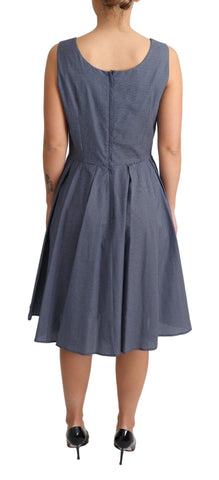 Blue polka dot cotton A-line stretch dress by Dolce & Gabbana, shown on a hanger with a fitted waist and flared skirt.