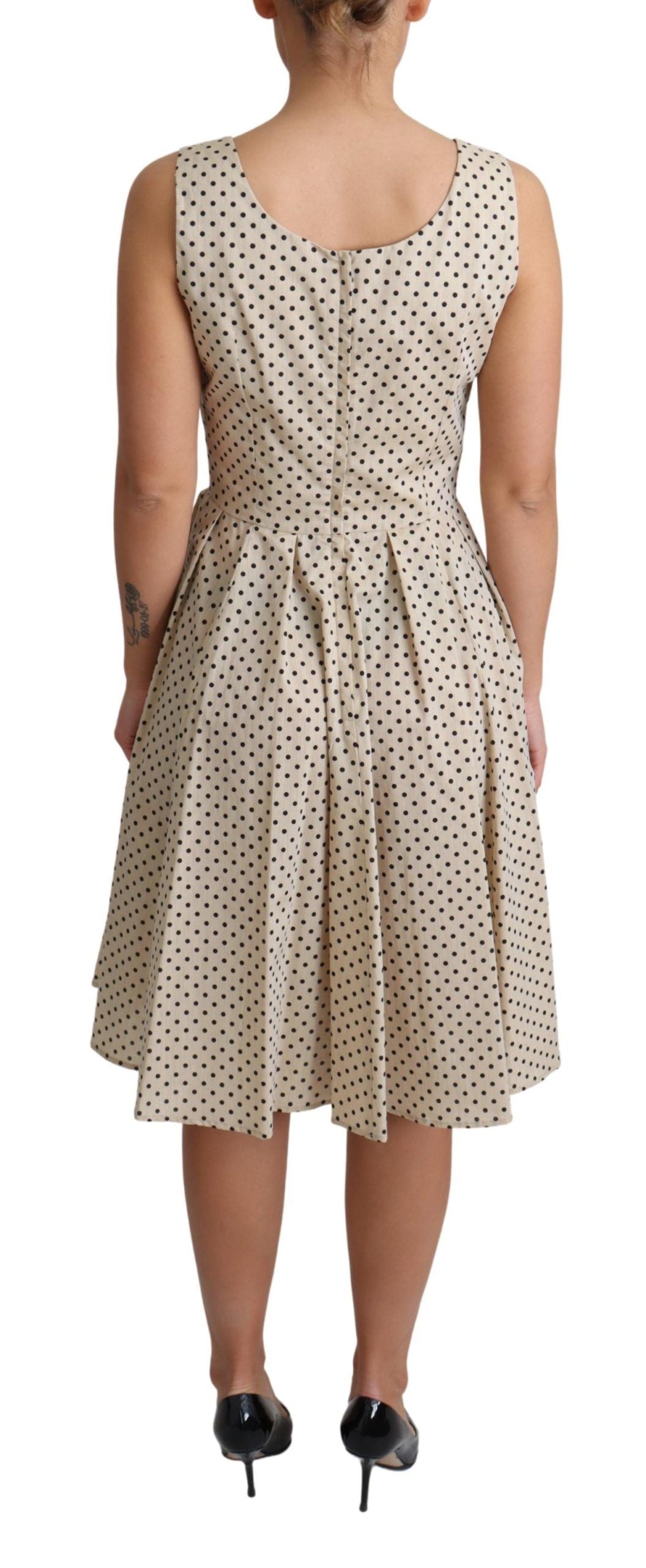 Beige polka dotted cotton A-line dress by Dolce & Gabbana, featuring a flattering fit and classic pattern.