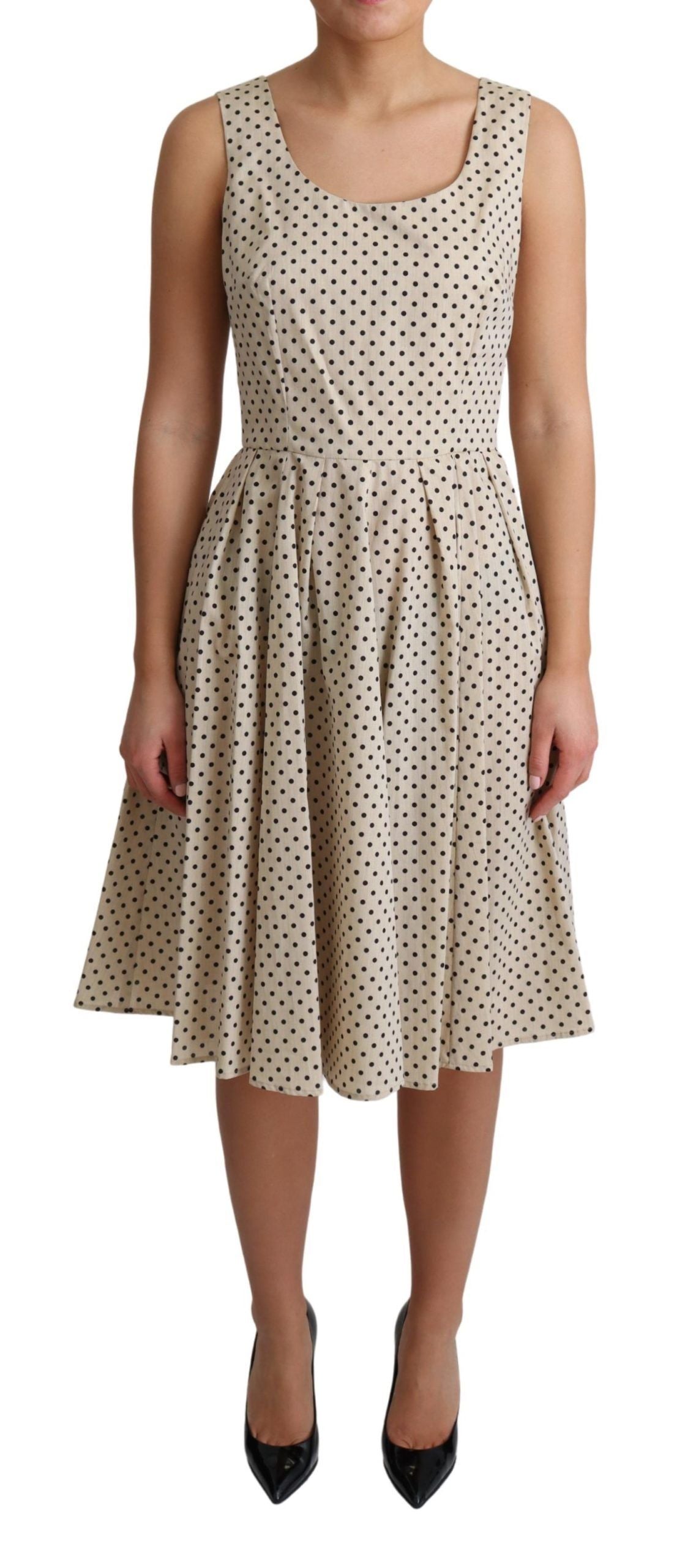 Beige polka dotted cotton A-line dress by Dolce & Gabbana, featuring a classic design and lightweight fabric.