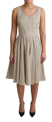 Beige polka dotted cotton A-line dress by Dolce & Gabbana, featuring a classic design and lightweight fabric.