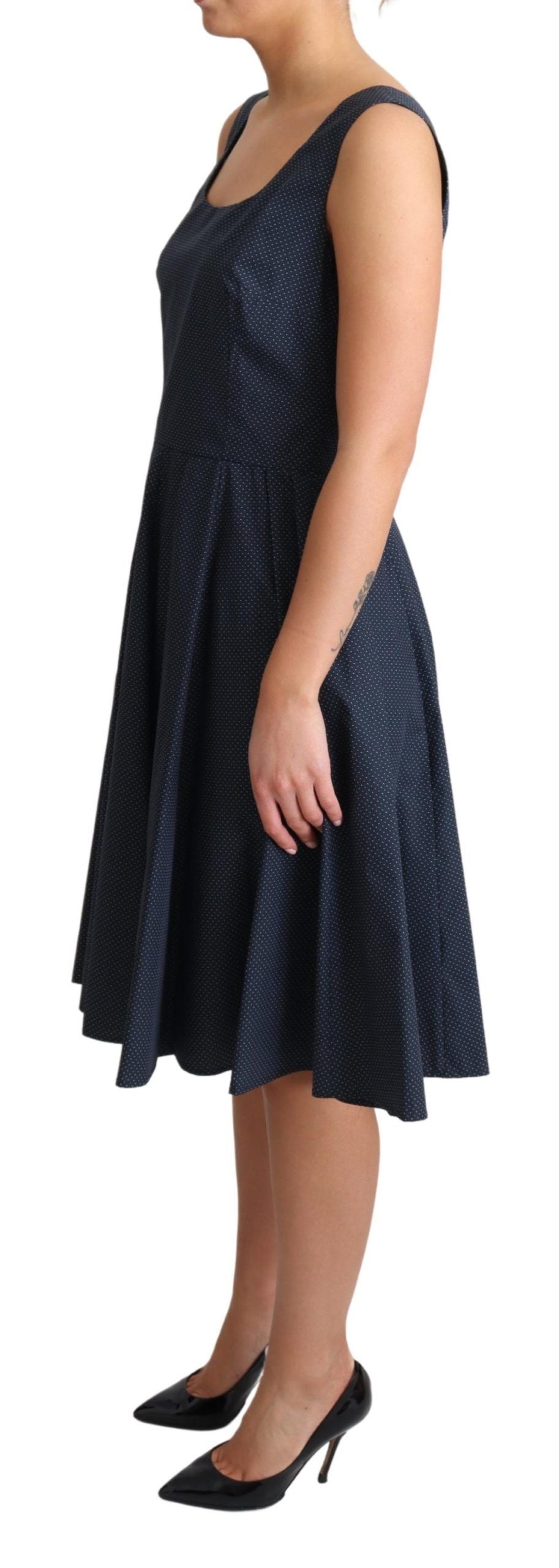 Blue polka dotted cotton A-line dress by Dolce & Gabbana displayed on a hanger.