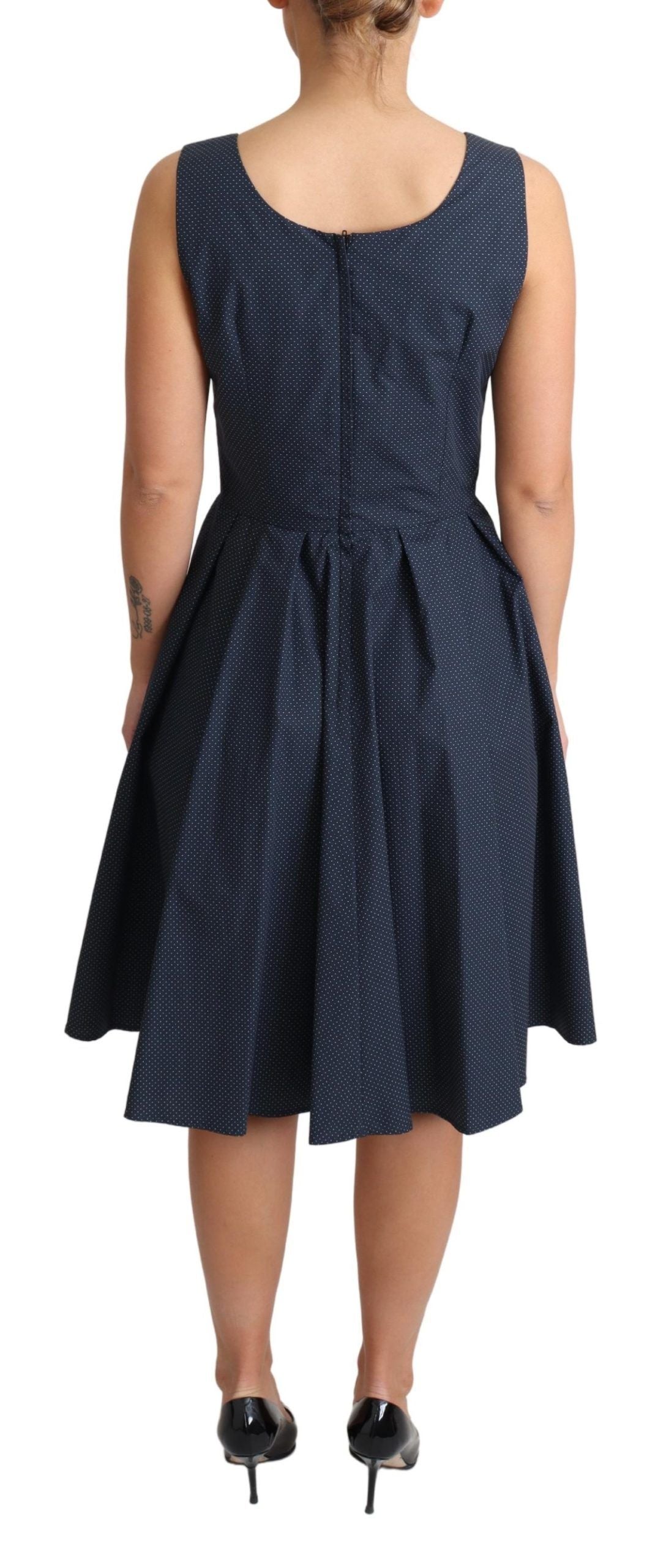 Blue polka dotted cotton A-line dress by Dolce & Gabbana with a fitted bodice and flowing skirt, perfect for casual or summer wear.