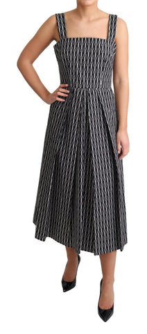 Dolce & Gabbana black and white patterned cotton A-line dress displayed on a hanger.