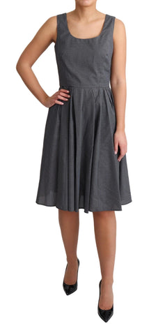 Black polka dotted cotton A-line dress by Dolce & Gabbana, featuring a classic fit and playful pattern.