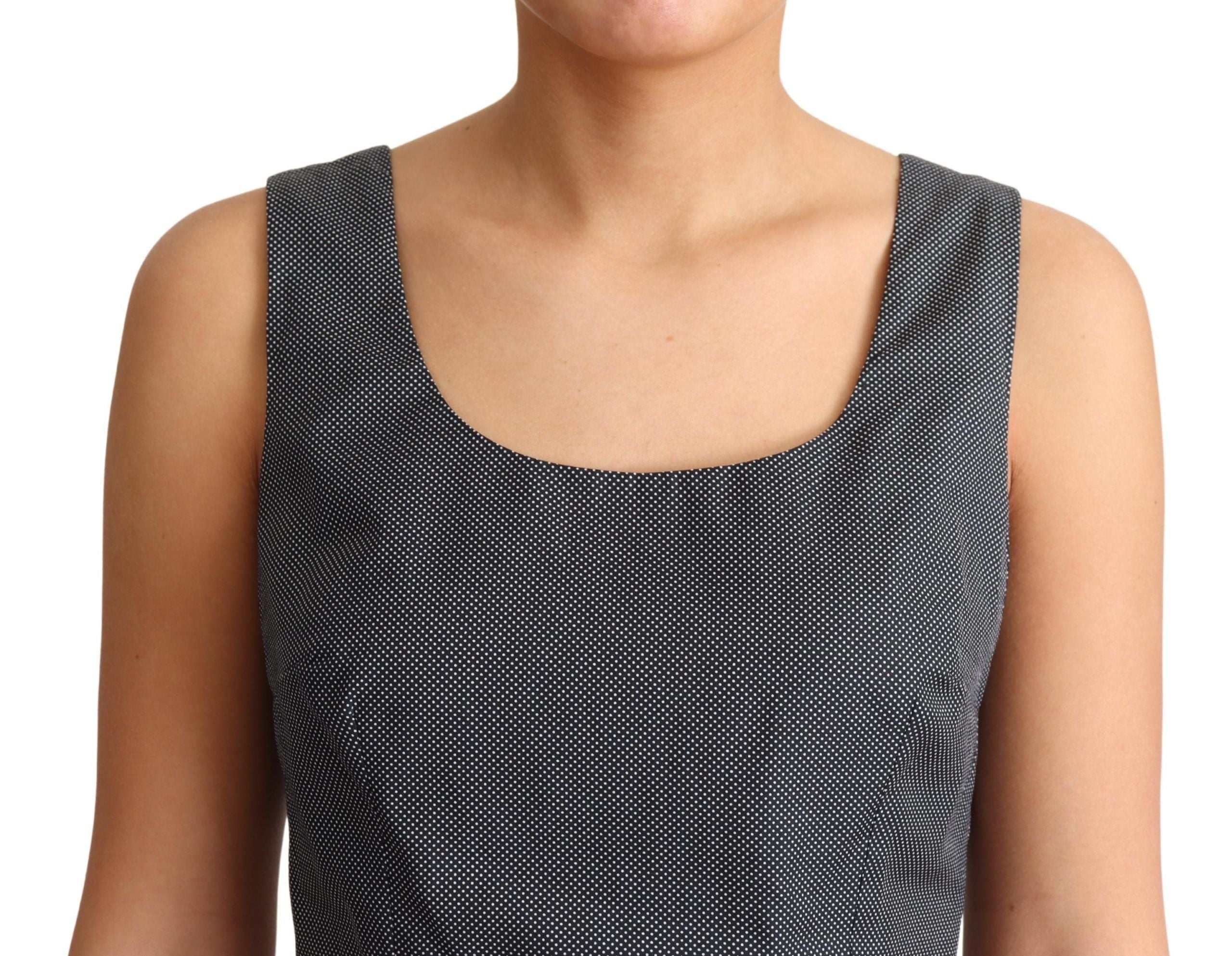 Black polka dotted cotton A-line dress by Dolce & Gabbana, featuring a classic silhouette and playful pattern.