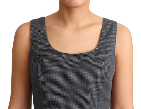 Black polka dotted cotton A-line dress by Dolce & Gabbana, featuring a classic silhouette and playful pattern.