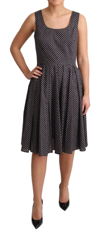 Black floral cotton A-line stretch dress by Dolce & Gabbana, featuring a fitted waist and feminine floral pattern.