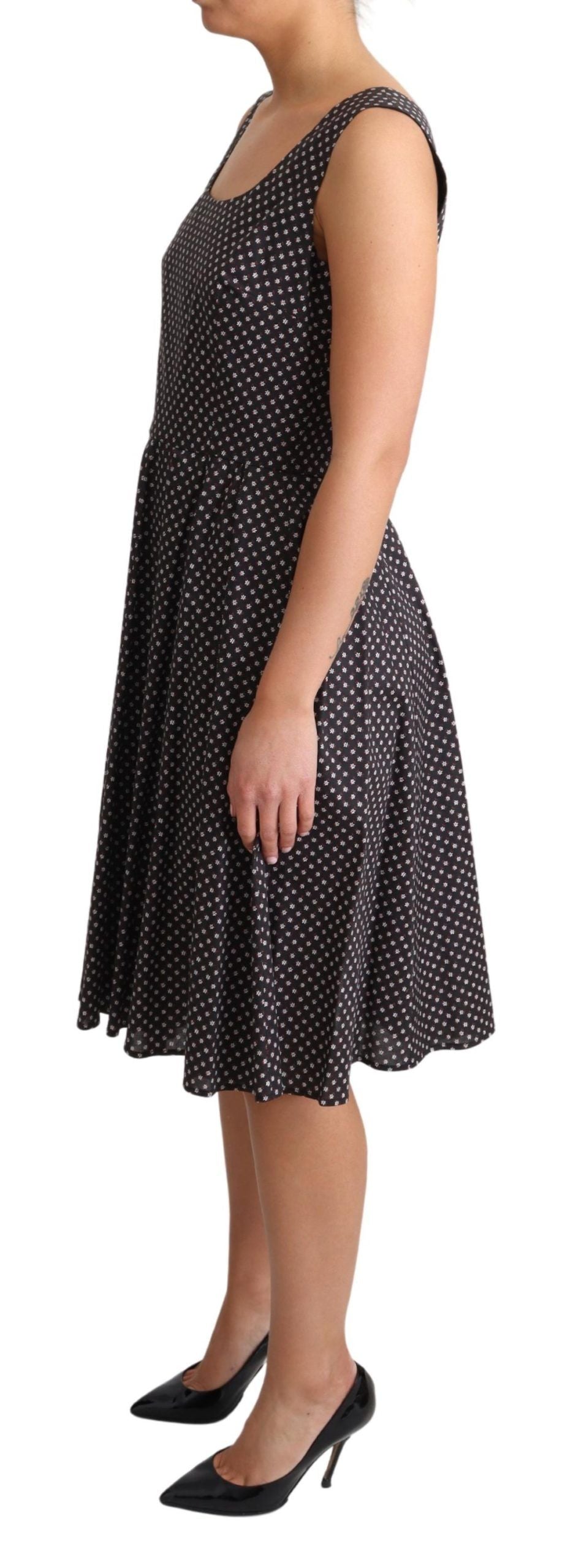 Black floral cotton A-line stretch dress by Dolce & Gabbana, featuring a fitted bodice and flowy skirt.